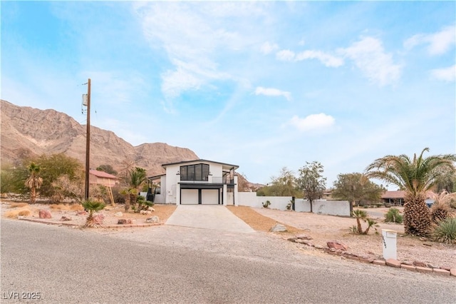 view of front of home featuring a mountain view