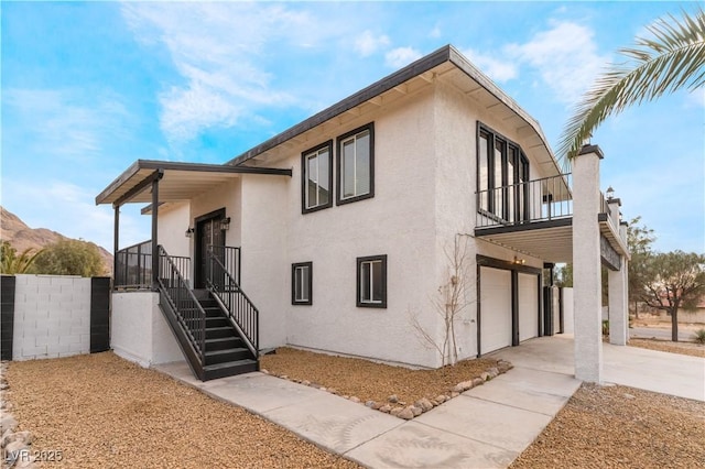 view of side of home with a garage