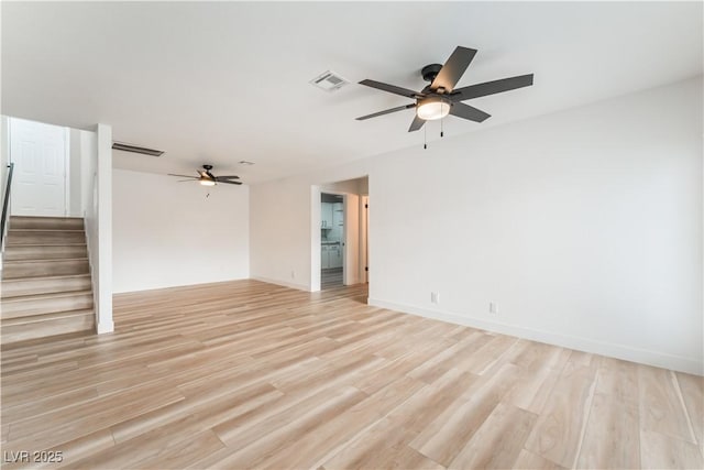 unfurnished room featuring ceiling fan and light wood-type flooring