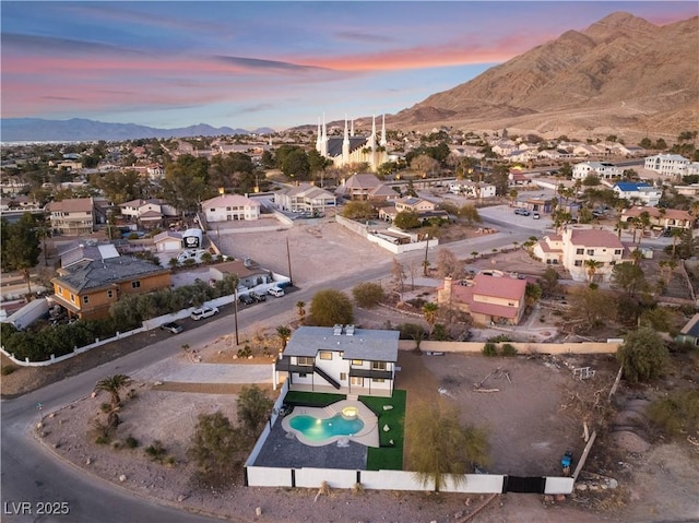 aerial view at dusk with a mountain view