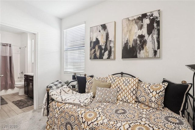 bedroom with multiple windows and ensuite bath