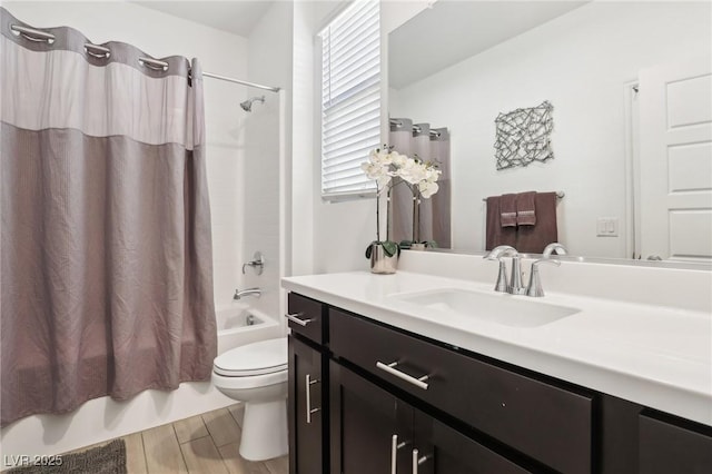 full bathroom with vanity, shower / bath combination with curtain, and toilet