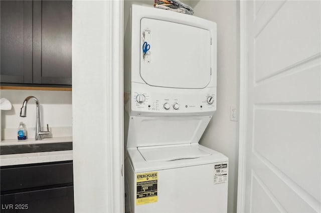 laundry room with stacked washer / dryer and sink