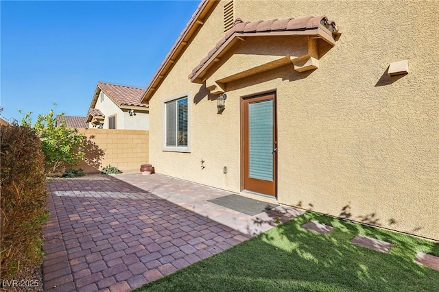 back of house with a patio area