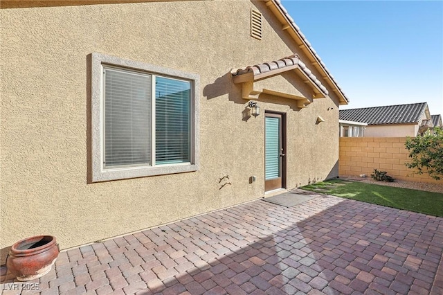 back of house featuring a patio area