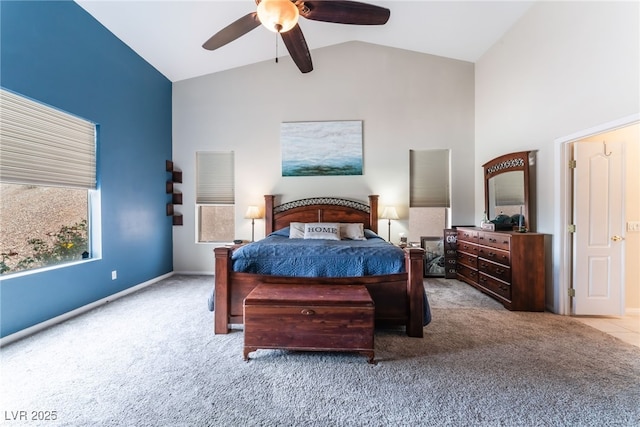 bedroom with baseboards, carpet, high vaulted ceiling, and a ceiling fan