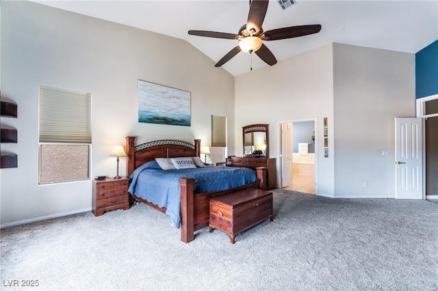 carpeted bedroom with a ceiling fan, baseboards, high vaulted ceiling, and connected bathroom