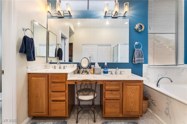 bathroom with double vanity, an inviting chandelier, and a sink