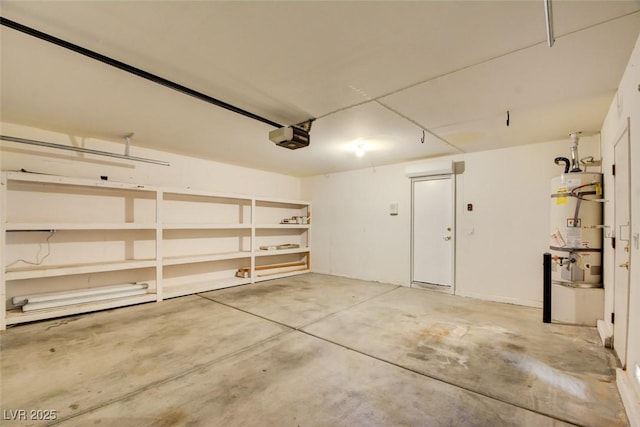 garage with secured water heater and a garage door opener