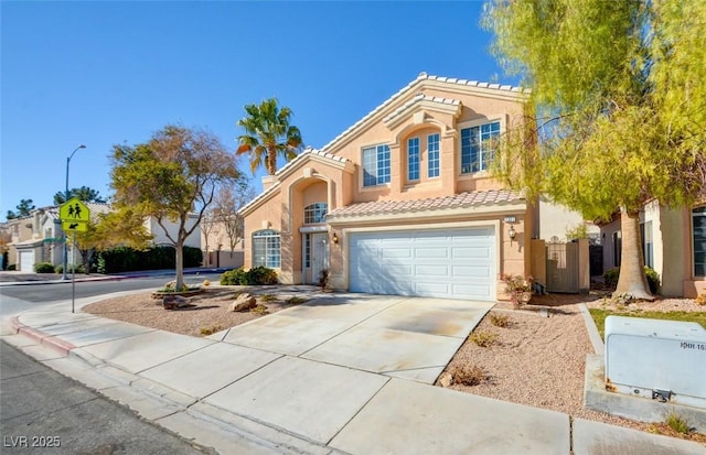 mediterranean / spanish house featuring a garage