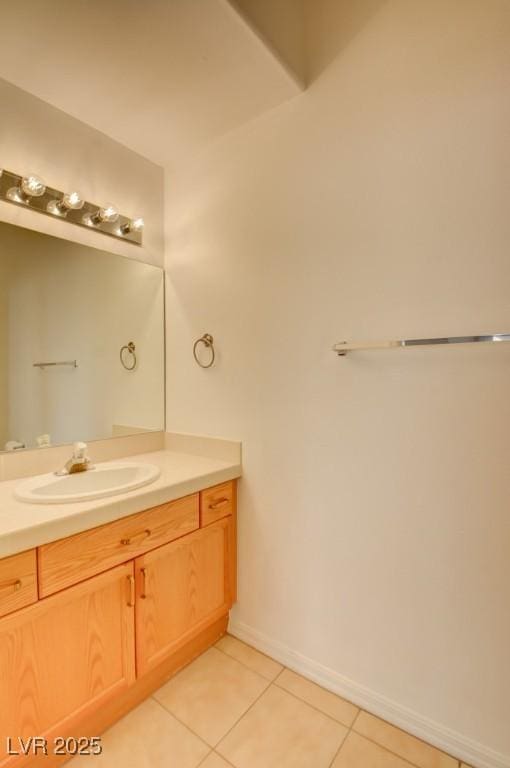 bathroom with tile patterned floors and vanity