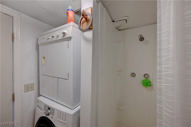 laundry area featuring stacked washer and clothes dryer