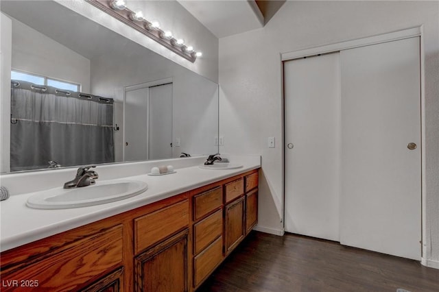 bathroom with vanity and wood-type flooring