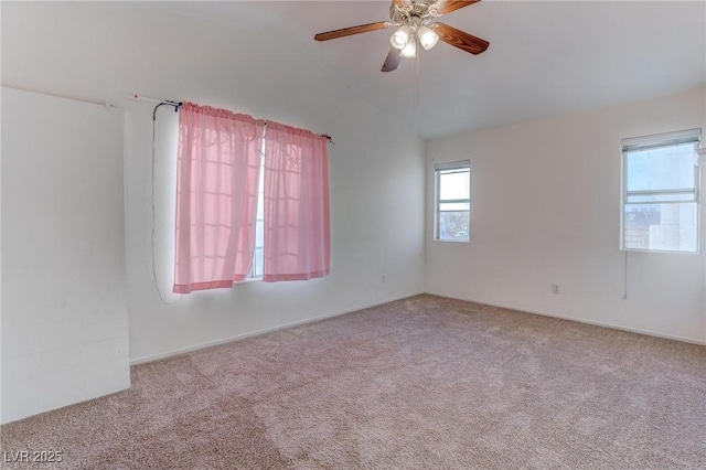 carpeted empty room with ceiling fan and lofted ceiling