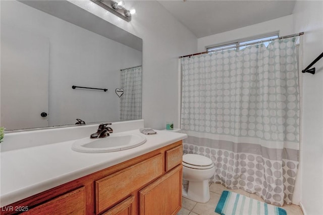 bathroom with tile patterned floors, toilet, and vanity