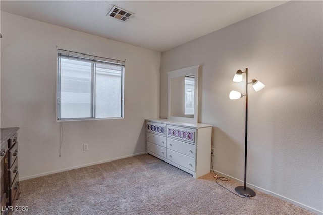 unfurnished bedroom featuring light colored carpet