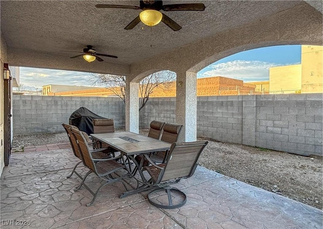 view of patio featuring a grill and ceiling fan