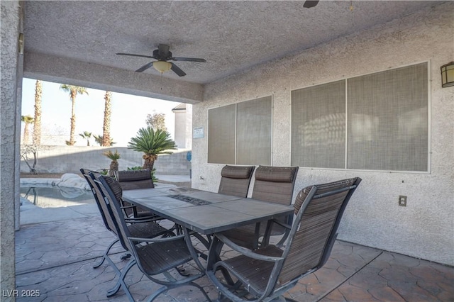 view of patio featuring outdoor dining space and ceiling fan