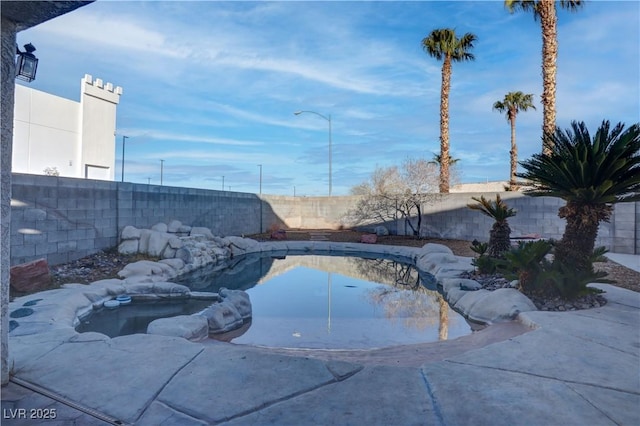 view of pool featuring a fenced backyard