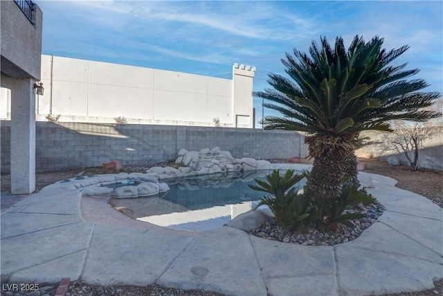 exterior details with a fenced backyard