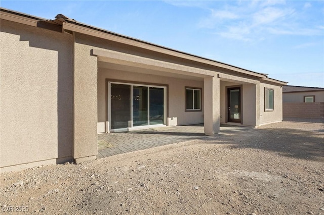 rear view of house featuring a patio