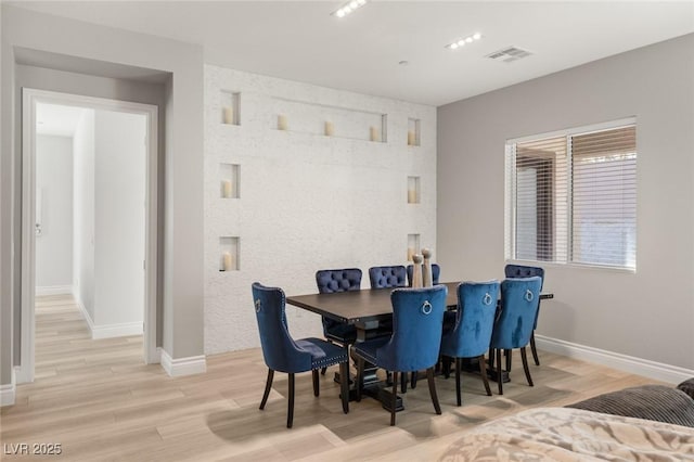 dining room with light wood-type flooring