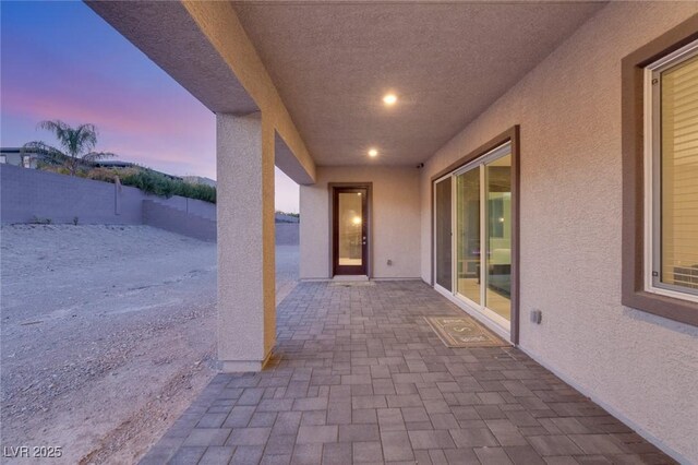 view of patio terrace at dusk