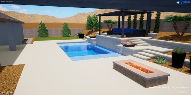 view of pool with a patio, a mountain view, and a fire pit