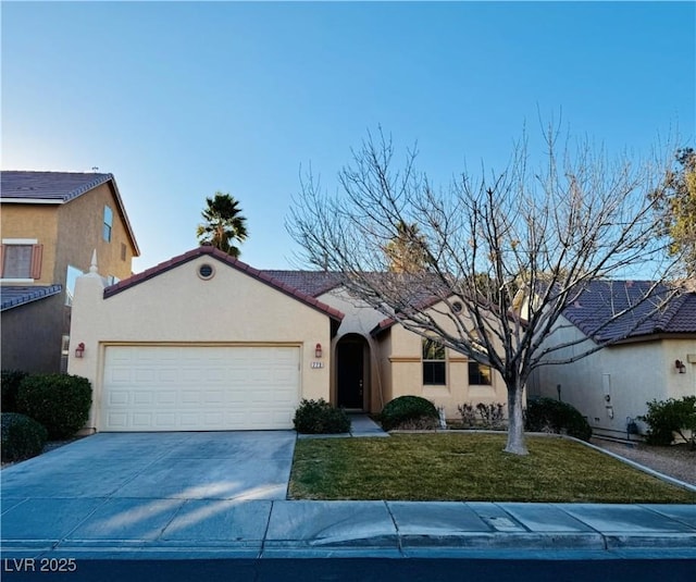 view of front of house with a garage and a front yard