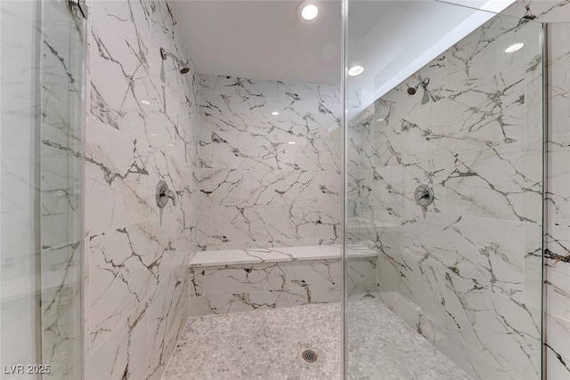 bathroom with a tile shower