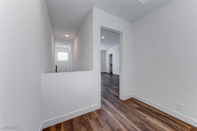 corridor featuring dark wood-type flooring