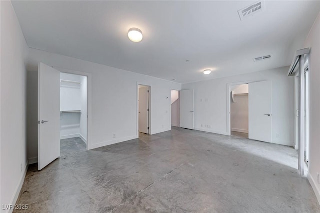 unfurnished bedroom with a spacious closet and a closet