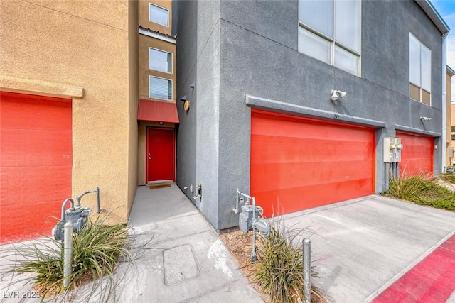 view of exterior entry with a garage