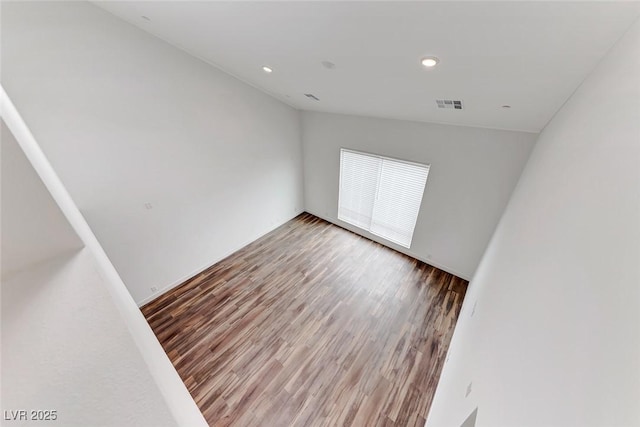 empty room featuring wood-type flooring