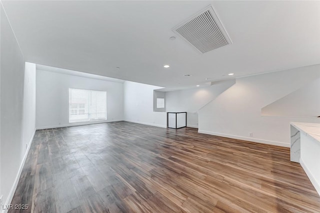 unfurnished living room featuring wood-type flooring