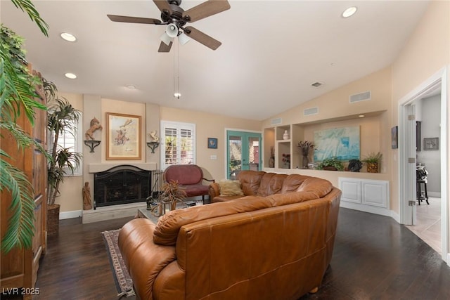 living room with french doors, ceiling fan, lofted ceiling, and dark hardwood / wood-style floors