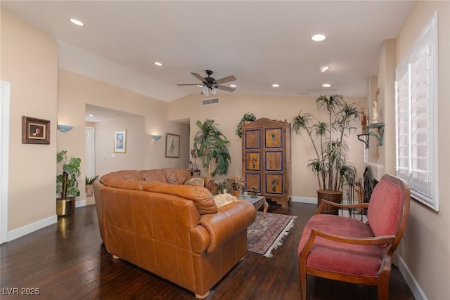 living room featuring dark hardwood / wood-style flooring, vaulted ceiling, and ceiling fan