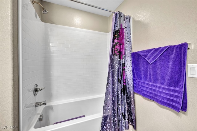 bathroom featuring shower / bathtub combination with curtain