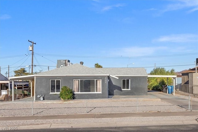 single story home featuring a carport