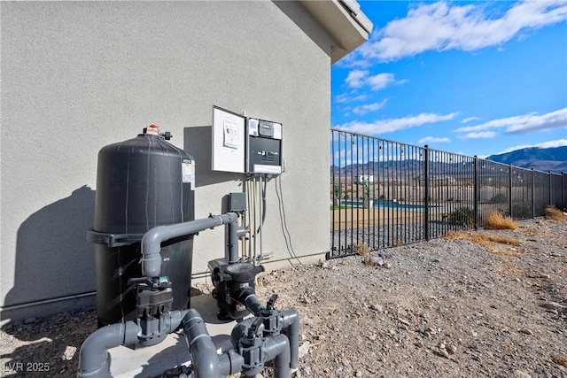 exterior details featuring a pool and a mountain view