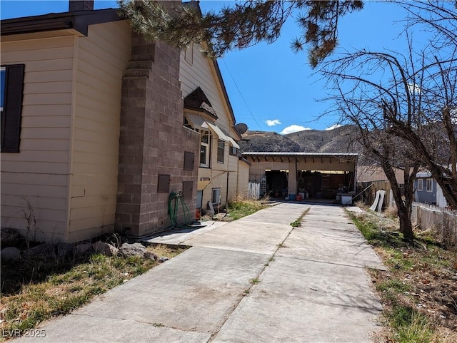 view of side of property featuring a mountain view