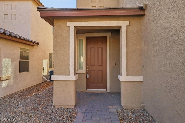 property entrance featuring cooling unit