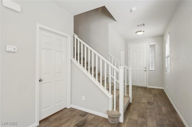 foyer entrance featuring dark hardwood / wood-style flooring