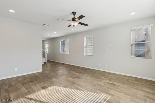 unfurnished room featuring ceiling fan and light hardwood / wood-style flooring