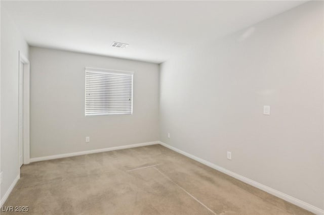 empty room with light colored carpet