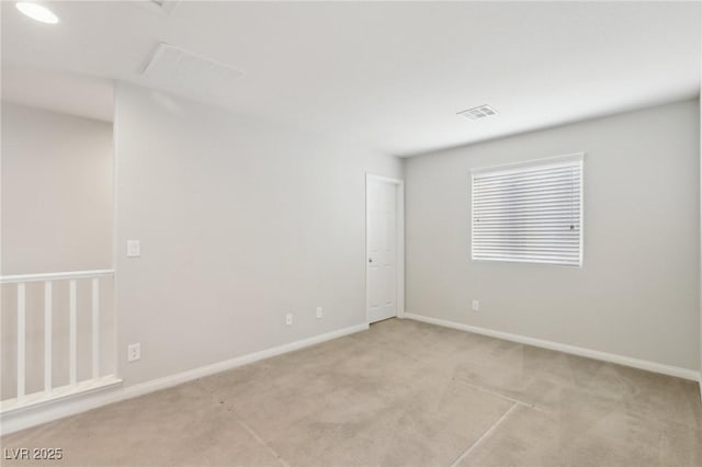 empty room featuring light colored carpet