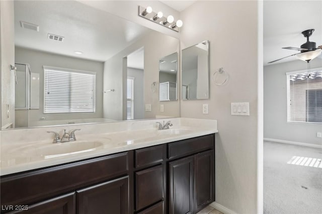 bathroom with ceiling fan and vanity