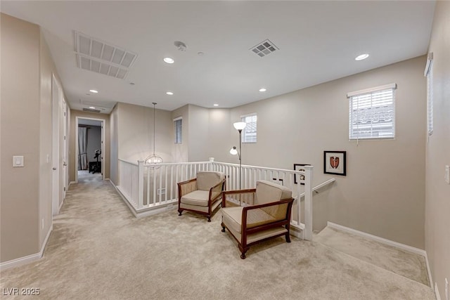 living area with light carpet