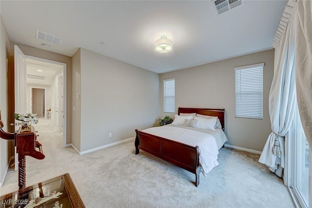 bedroom with light colored carpet