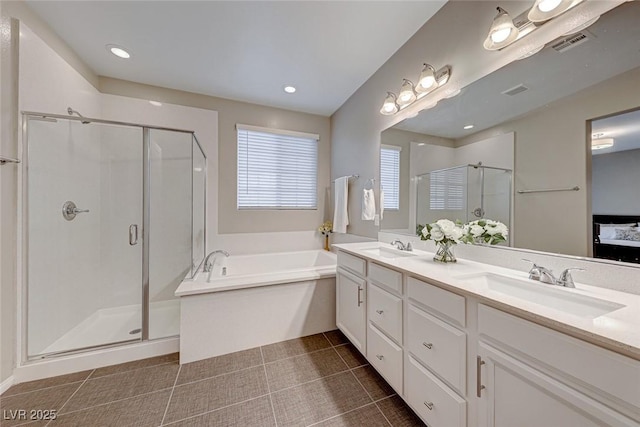 bathroom with tile patterned flooring, vanity, and independent shower and bath